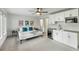 Bright bedroom featuring modern decor with kitchenette, ceiling fan, and a comfortable bed with stylish accents at 4060 S Rhett Ave, North Charleston, SC 29405
