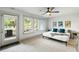 Inviting bedroom featuring ample natural light, neutral tones, ceiling fan and comfortable bed with stylish accents at 4060 S Rhett Ave, North Charleston, SC 29405