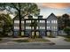 Charming townhome complex featuring a modern exterior design and individual driveways, blending comfort and style at 4060 S Rhett Ave, North Charleston, SC 29405