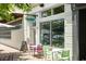 Bright white building with large windows, displaying the 'Odd Duck' sign and a charming outdoor dining setup at 4060 S Rhett Ave, North Charleston, SC 29405