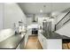 Sleek kitchen with white cabinetry, stainless steel appliances, and spacious island with bar seating at 4060 S Rhett Ave, North Charleston, SC 29405