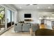 Open living area with hardwood floors, comfortable seating and great views of nature at 4060 S Rhett Ave, North Charleston, SC 29405