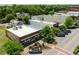 Quaint retail building with awnings, street-side parking, and charming landscaping at 4060 S Rhett Ave, North Charleston, SC 29405