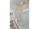 Bright bathroom features a glass shower and ample natural light at 4235 Royal Harbor Rd, Hollywood, SC 29449