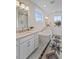 Bright bathroom features a tub, glass shower, double vanity and ample natural light at 4235 Royal Harbor Rd, Hollywood, SC 29449