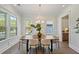 Elegant dining room with hardwood floors, lots of light, and wainscoting at 4235 Royal Harbor Rd, Hollywood, SC 29449
