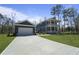 New construction home with blue siding, white trim, large driveway, garage and spacious manicured lawn at 4235 Royal Harbor Rd, Hollywood, SC 29449