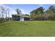 Exterior of a home with a large yard and a detached garage in a rural setting at 4235 Royal Harbor Rd, Hollywood, SC 29449