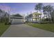 Charming exterior of a two-story home with a detached garage and long concrete driveway at 4235 Royal Harbor Rd, Hollywood, SC 29449