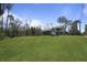 Exterior of a home with a detached garage on a vast, well-manicured lawn at 4235 Royal Harbor Rd, Hollywood, SC 29449