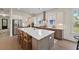 Spacious open kitchen with stainless appliances, seating around island, and natural light at 4235 Royal Harbor Rd, Hollywood, SC 29449