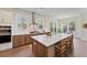Bright kitchen boasts a large island with seating, stainless appliances, and natural light at 4235 Royal Harbor Rd, Hollywood, SC 29449