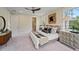 Bright main bedroom featuring a king-size bed and walk-in closet with natural light at 4235 Royal Harbor Rd, Hollywood, SC 29449