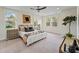 Bright main bedroom featuring a king-size bed and large windows with natural light at 4235 Royal Harbor Rd, Hollywood, SC 29449