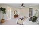 Bright main bedroom with access to a bathroom and walk-in closet at 4235 Royal Harbor Rd, Hollywood, SC 29449