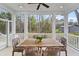 Screened in porch features an outdoor dining area and private backyard views at 4235 Royal Harbor Rd, Hollywood, SC 29449