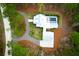 Expansive aerial view of the property with a well-manicured lawn, a private pool, and mature trees at 4310 Stonehouse Cir, Awendaw, SC 29429