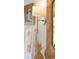 Bathroom detail showcasing a bamboo mirror, decorative towels, and modern sconce lighting at 4310 Stonehouse Cir, Awendaw, SC 29429