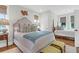Bedroom featuring two beds, decorative pillows, and a seating bench at 4310 Stonehouse Cir, Awendaw, SC 29429