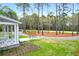 A charming view of a well-manicured front yard, showcasing a quaint porch and a winding driveway at 4310 Stonehouse Cir, Awendaw, SC 29429