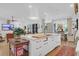 Bright kitchen with large island, stylish pendant lighting, and open to the living area at 4310 Stonehouse Cir, Awendaw, SC 29429