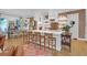 Modern kitchen featuring a large island, counter seating, and brick accents at 4310 Stonehouse Cir, Awendaw, SC 29429