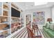Comfortable living room featuring custom shelving and a neutral color palette at 4310 Stonehouse Cir, Awendaw, SC 29429