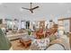 Spacious living area connects to dining area, featuring stylish decor and ample natural light at 4310 Stonehouse Cir, Awendaw, SC 29429