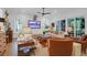 Open-concept living room featuring modern furnishings, shiplap walls, and access to the backyard at 4310 Stonehouse Cir, Awendaw, SC 29429