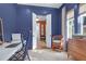Stylish home office with dark blue walls and designer chair at 4310 Stonehouse Cir, Awendaw, SC 29429
