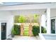 Charming gated outdoor area with brick accents, lush greenery, and access to the main house at 4310 Stonehouse Cir, Awendaw, SC 29429