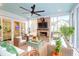 Relaxing sunroom with comfortable wicker furniture and views of the garden at 4310 Stonehouse Cir, Awendaw, SC 29429