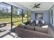 Relaxing screened patio with comfortable seating, outdoor fireplace, and a view of the backyard at 5104 Coneflower Ct, Johns Island, SC 29455
