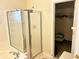 Bathroom featuring a glass-enclosed shower and a walk-in closet at 5182 Forest Oaks Dr, Hollywood, SC 29449