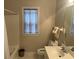 Cozy bathroom featuring a tub, tile flooring, vanity, and a window with decorative curtain at 5182 Forest Oaks Dr, Hollywood, SC 29449