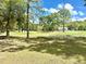 Picturesque golf course community featuring open green spaces, mature trees, and peaceful recreational opportunities at 5182 Forest Oaks Dr, Hollywood, SC 29449