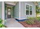 Close up view of a charming and inviting front entrance of a single-Gathering home at 5560 Alpine Dr, Summerville, SC 29483