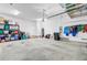Well-organized garage with shelving and storage solutions, offering plenty of space for vehicles and equipment at 5560 Alpine Dr, Summerville, SC 29483