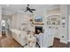 Relaxing living room featuring a fireplace, built in shelving, comfortable seating and hardwood floors at 5560 Alpine Dr, Summerville, SC 29483