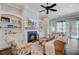Cozy living room with fireplace, built-in shelving, and comfortable seating at 5560 Alpine Dr, Summerville, SC 29483