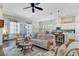 Inviting living room showcasing seamless transition to the kitchen and dining areas at 5560 Alpine Dr, Summerville, SC 29483