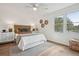 Cozy bedroom with a ceiling fan, wicker accents, a large window, and modern decor at 5573 Betty Ct, North Charleston, SC 29418