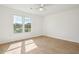 Bedroom with light wood floors, white walls, and large window at 5573 Betty Ct, North Charleston, SC 29418