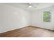 Bedroom with light wood floors, white walls, and one window at 5573 Betty Ct, North Charleston, SC 29418