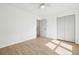 Bedroom with light wood floors and a closet with bi-fold doors at 5573 Betty Ct, North Charleston, SC 29418