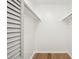 Empty closet with painted wood floor, white walls, and shelf for storage at 5573 Betty Ct, North Charleston, SC 29418