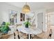 Bright dining area with marble table and modern light fixture at 5573 Betty Ct, North Charleston, SC 29418