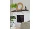 Close-up of a painted brick fireplace with decorative mantel at 5573 Betty Ct, North Charleston, SC 29418