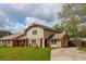 Charming two-story home featuring a well-manicured lawn, inviting front porch, and driveway at 5573 Betty Ct, North Charleston, SC 29418