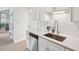 Bright kitchen features stainless steel appliances, white cabinetry, quartz countertops, and modern hardware at 5573 Betty Ct, North Charleston, SC 29418